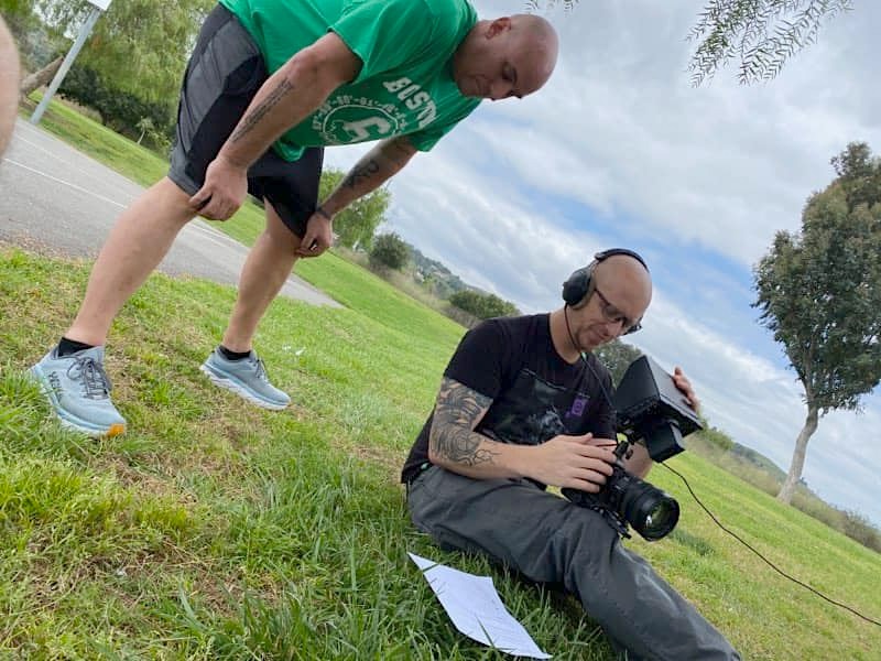 Greg on location with camera equipment